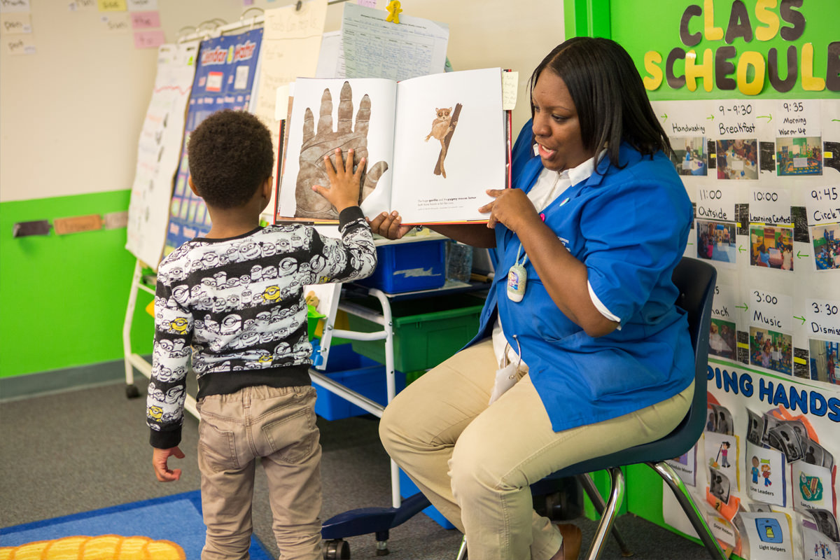 A child enjoying a BLueprint book.